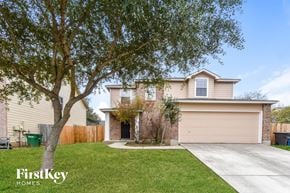 San Antonio house for rent - a home with a tree in the yard and a driveway