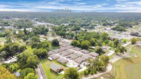 Houston apartment for rent - A bird's eye view of a residential area with houses and trees.
