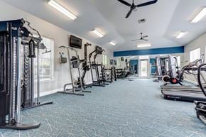Lafayette apartment for rent - a gym with weights and cardio equipment on the floor and a window