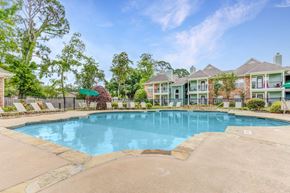 Lafayette apartment for rent - a swimming pool with apartments in the background
