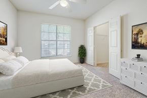 Lafayette apartment for rent - a bedroom with a white bed and a white dresser