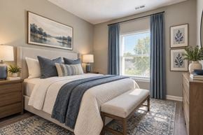 Wayne townhouse for rent - A bedroom with a large bed and a painting on the wall.