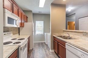 Wayne townhouse for rent - a kitchen with a stove and a sink and a microwave