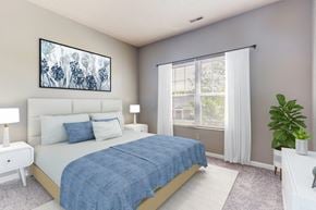 Wayne townhouse for rent - a bedroom with a bed and a large window
