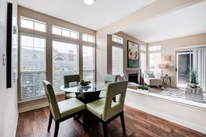Cincinnati apartment for rent - a dining room with large windows and a table and chairs