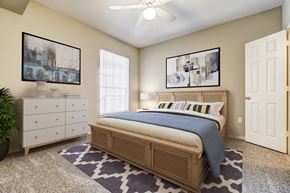 Shreveport apartment for rent - a bedroom with a bed and a dresser