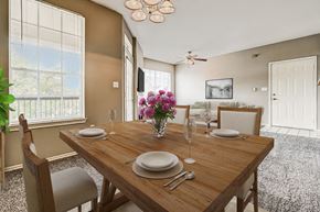 Shreveport apartment for rent - a dining room with a wooden table and chairs