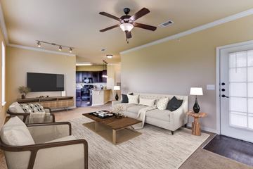 Lafayette apartment for rent - a living room with a ceiling fan and a couch