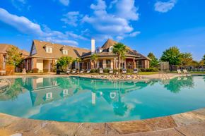 Lafayette apartment for rent - a large swimming pool with a house in the background