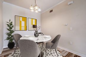Slidell apartment for rent - a dining room with a table and chairs
