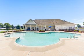 Portage apartment for rent - A large swimming pool in front of a building.