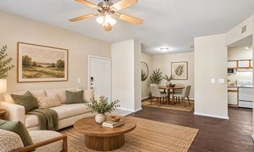 Cedar Hill townhouse for rent - A living room with a white couch and a painting on the wall.