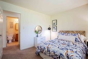 Owings Mills townhouse for rent - a bedroom with a bed and a bathroom with a toilet