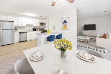 Owings Mills townhouse for rent - a kitchen and living room with a white table