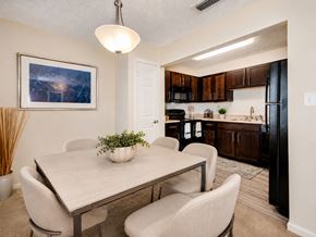 Tampa townhouse for rent - A dining room with a table and chairs.