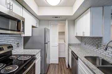 Lafayette apartment for rent - A kitchen with a stove, refrigerator, and sink.