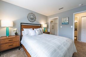 Miamisburg apartment for rent - a bedroom with a large bed and a closet