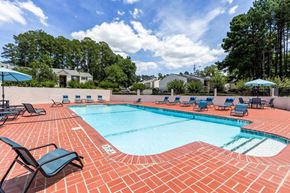 Augusta apartment for rent - a swimming pool with chairs and umbrellas