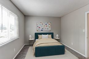 Augusta apartment for rent - a bedroom with a bed and a large window