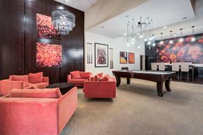 Tampa apartment for rent - a game room with a pool table and couches