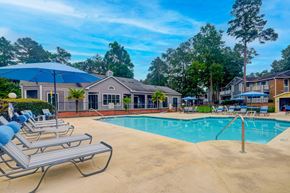 Aiken apartment for rent - our apartments offer a swimming pool with chairs and umbrellas