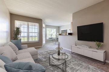 Slidell apartment for rent - a living room with a couch and a television