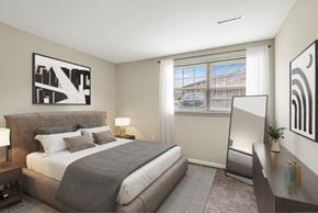 Glen Burnie townhouse for rent - a bedroom with a bed and a large window