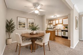 Woodridge apartment for rent - A dining room with a round table and chairs.