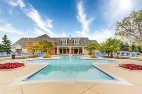 Woodridge apartment for rent - a large swimming pool with a house in the background