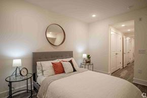 Philadephia apartment for rent - a bedroom with a large bed and a mirror