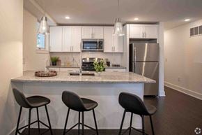 Philadephia apartment for rent - a kitchen with a island and three stools