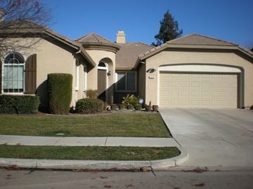 Patterson house for rent - a house with a driveway and a garage door
