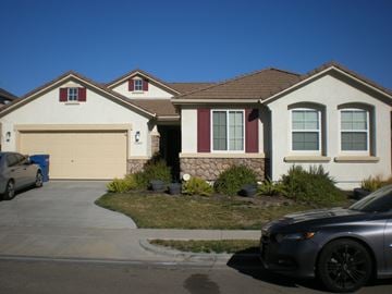 Patterson house for rent - a house with a car garage in front of it