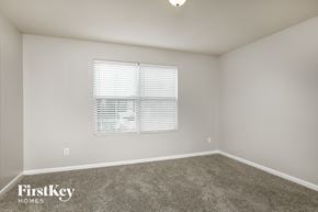 Raleigh house for rent - a spacious room with carpet and a window