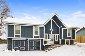 Kansas City house for rent - a blue house with snow on the roof