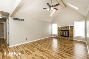Kansas City house for rent - the living room has a fireplace and hardwood floors