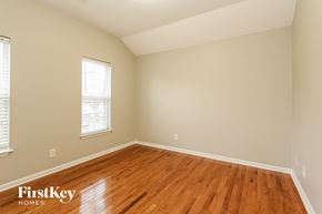 Charlotte house for rent - the second bedroom with hardwood flooring and a window