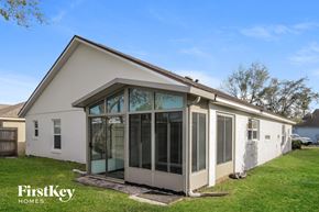 Orlando house for rent - the exterior of a house with a patio and glass doors