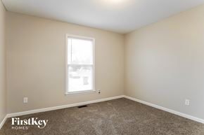 Raleigh house for rent - a bedroom with carpet and a window