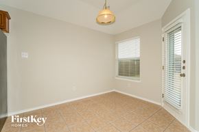 Forney house for rent - a dining room with a tile floor and a window