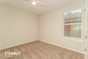 Forney house for rent - the upstairs bedroom has a carpeted floor and a window
