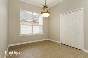 St Augustine house for rent - a dining room with a large window and a door and a chandelier