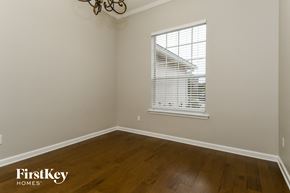 St Augustine house for rent - a bedroom with wood floors and a window