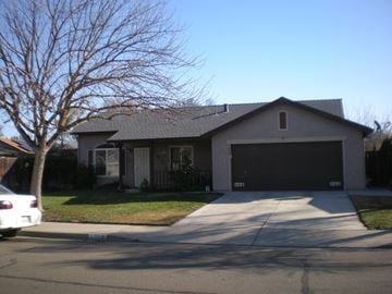 Newman house for rent - a house with a driveway and a garage door