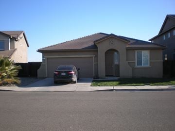 Newman house for rent - a house with a car parked in front of it