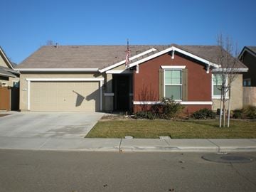 Newman house for rent - a house with a driveway and a garage door