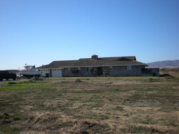 Patterson house for rent - a house with a boat on the side of it in a field