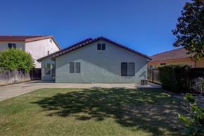 Patterson house for rent - A house with a grey exterior and a red tile roof.