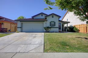 Patterson house for rent - A house with a garage and a driveway.