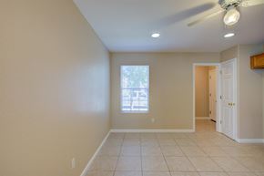 Patterson house for rent - A room with a ceiling fan and a window.